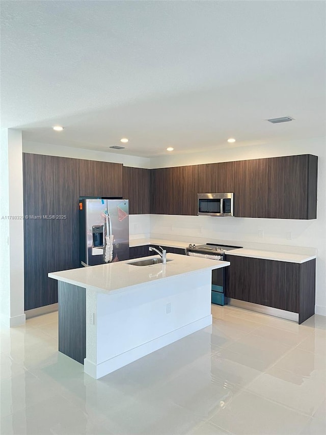 15771 SW 136th Ter, Miami, FL 33196 - kitchen featuring a sink, visible vents, appliances with stainless steel finishes, and modern cabinets