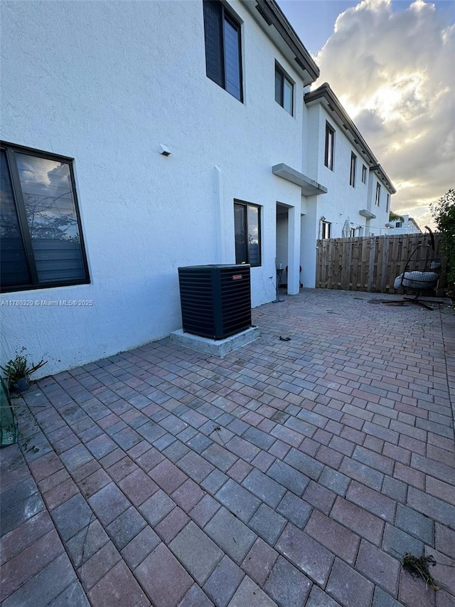 15771 SW 136th Ter, Miami, FL 33196 - view of patio featuring fence and central air condition unit
