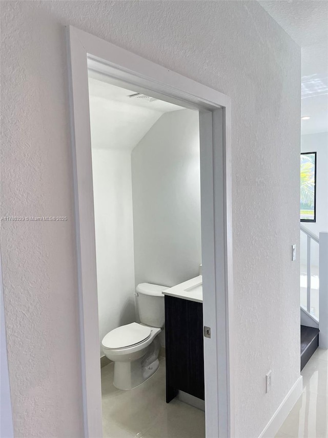 15771 SW 136th Ter, Miami, FL 33196 - bathroom featuring a textured wall, vanity, a textured ceiling, and toilet