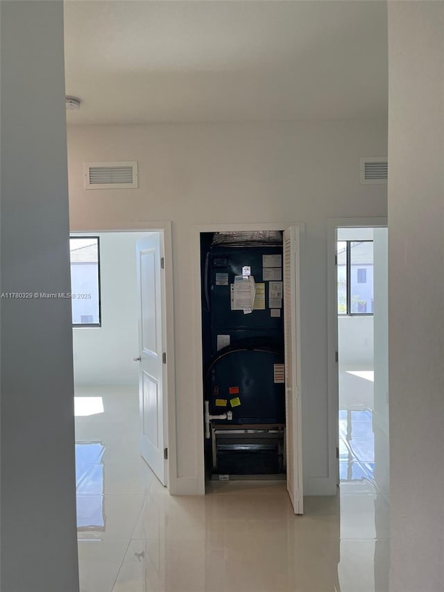 15771 SW 136th Ter, Miami, FL 33196 - hallway with visible vents and light tile patterned flooring