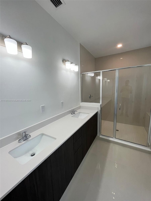 15771 SW 136th Ter, Miami, FL 33196 - bathroom with double vanity, visible vents, a sink, and a stall shower