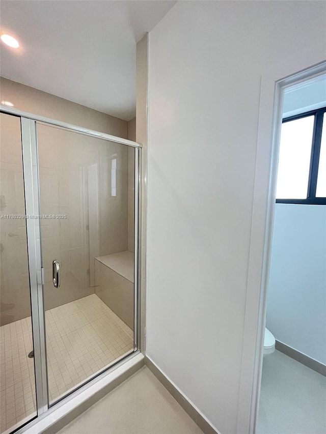 15771 SW 136th Ter, Miami, FL 33196 - bathroom with a shower stall, baseboards, and toilet
