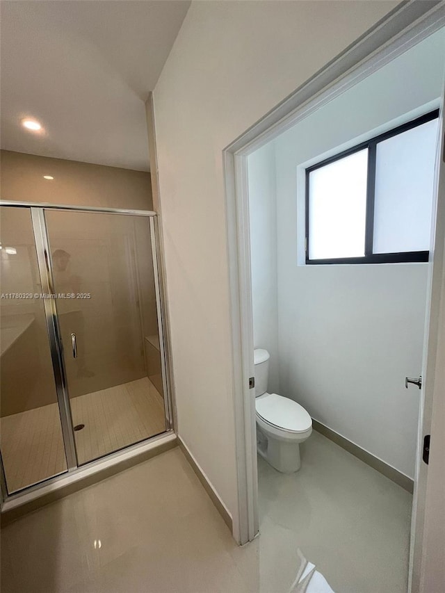 15771 SW 136th Ter, Miami, FL 33196 - full bath featuring tile patterned floors, toilet, a stall shower, and baseboards