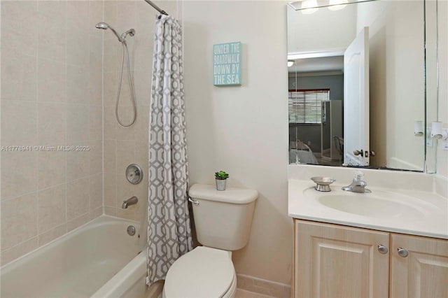 ensuite bathroom with toilet, shower / bath combo with shower curtain, ensuite bathroom, and vanity