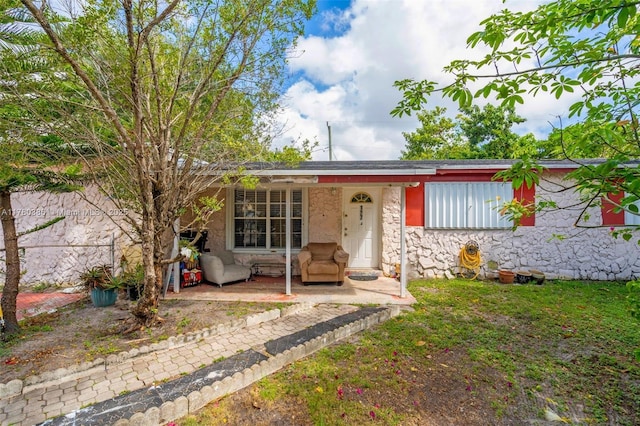 1271 NE 211th St, Miami, FL 33179 - single story home featuring a porch and stone siding