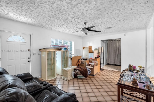1271 NE 211th St, Miami, FL 33179 - living area featuring a ceiling fan, a textured ceiling, and light tile patterned floors