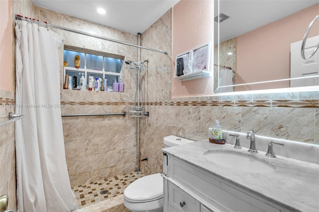1271 NE 211th St, Miami, FL 33179 - full bath featuring visible vents, tile walls, a stall shower, vanity, and toilet