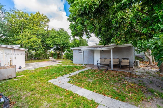 1271 NE 211th St, Miami, FL 33179 - view of yard with a patio area