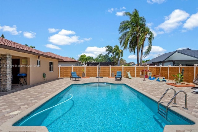 3663 SW 150th Ct, Miami, FL 33185 - view of swimming pool with a patio and grilling area
