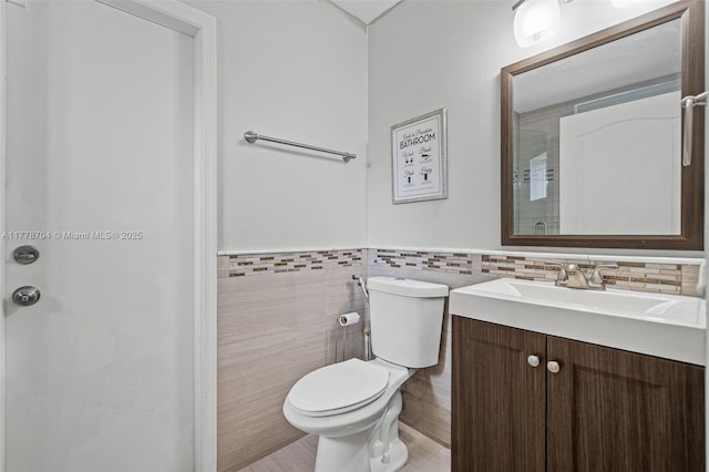 3663 SW 150th Ct, Miami, FL 33185 - bathroom featuring tile walls, vanity, and wainscoting