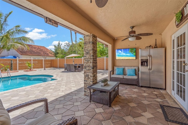 3663 SW 150th Ct, Miami, FL 33185 - fenced backyard featuring french doors, a ceiling fan, a patio, and outdoor lounge area