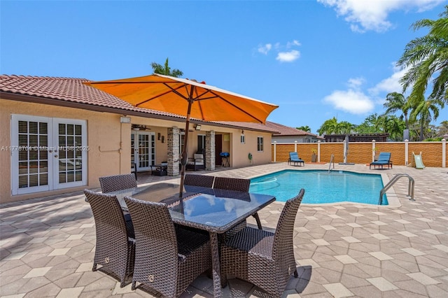 3663 SW 150th Ct, Miami, FL 33185 - view of swimming pool with french doors, a patio, and outdoor dining area