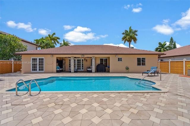 3663 SW 150th Ct, Miami, FL 33185 - view of swimming pool featuring french doors and a patio area