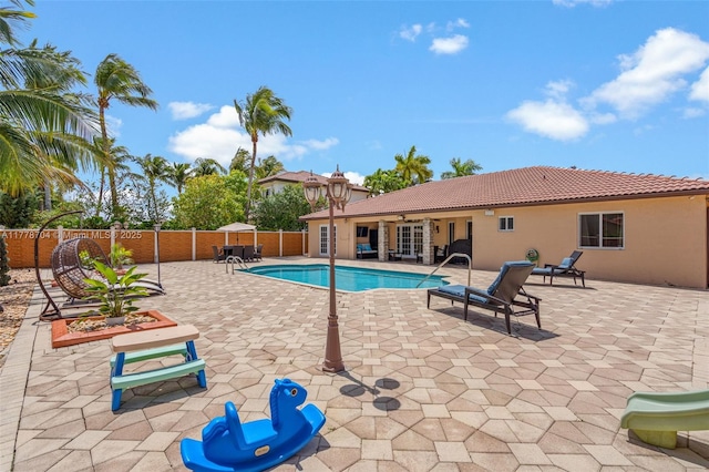 3663 SW 150th Ct, Miami, FL 33185 - view of swimming pool with a fenced backyard and a patio area