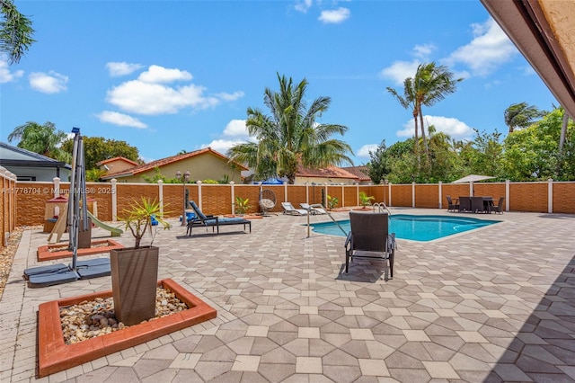 3663 SW 150th Ct, Miami, FL 33185 - view of swimming pool featuring a fenced backyard and a patio