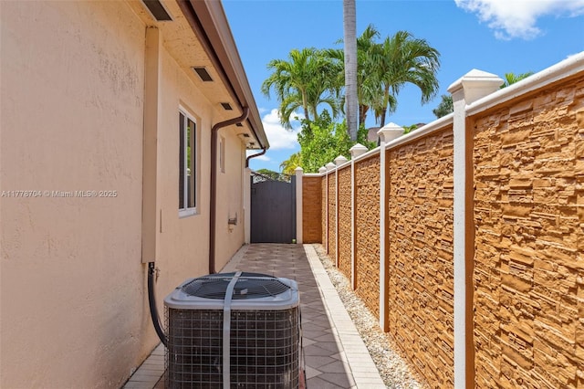 3663 SW 150th Ct, Miami, FL 33185 - view of side of property with stucco siding and a gate