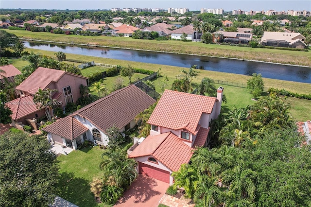 bird's eye view with a water view and a residential view