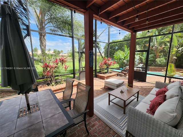 sunroom / solarium featuring plenty of natural light and outdoor lounge area