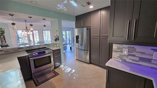 kitchen with pendant lighting, a ceiling fan, recessed lighting, appliances with stainless steel finishes, and light countertops