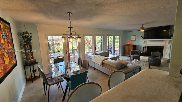 tiled living area featuring a textured ceiling, ceiling fan, and a fireplace with raised hearth