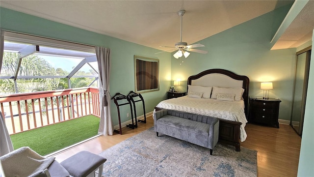 bedroom with wood finished floors, ceiling fan, and baseboards
