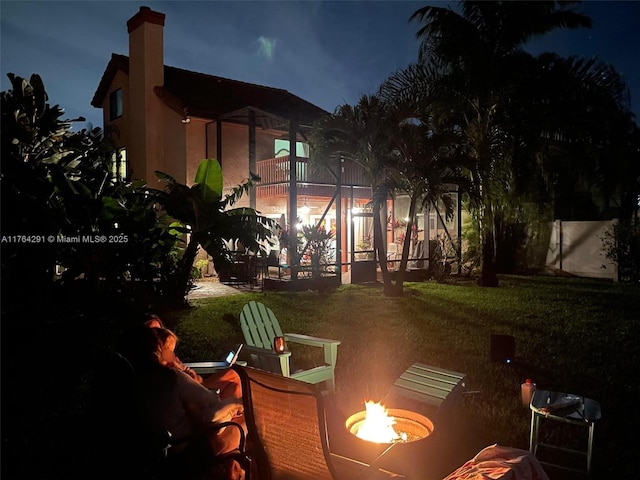 exterior space with an outdoor fire pit