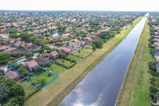 bird's eye view with a residential view and a water view
