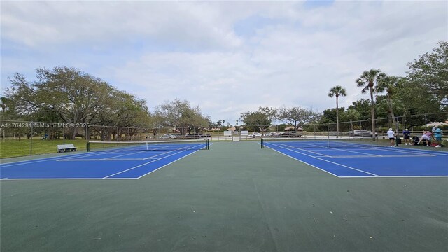 view of sport court with fence