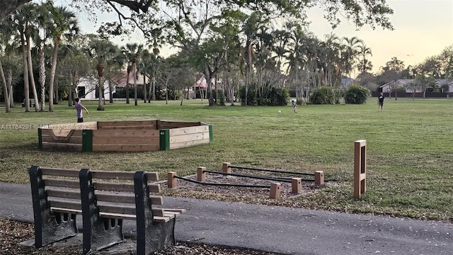 view of home's community with a lawn