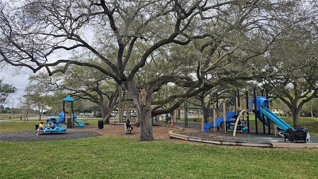 community playground featuring a lawn