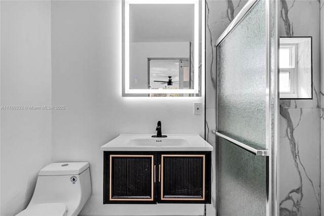 420 S 61st Ter, Hollywood, FL 33023 - bathroom with a shower stall, vanity, ceiling fan, and toilet