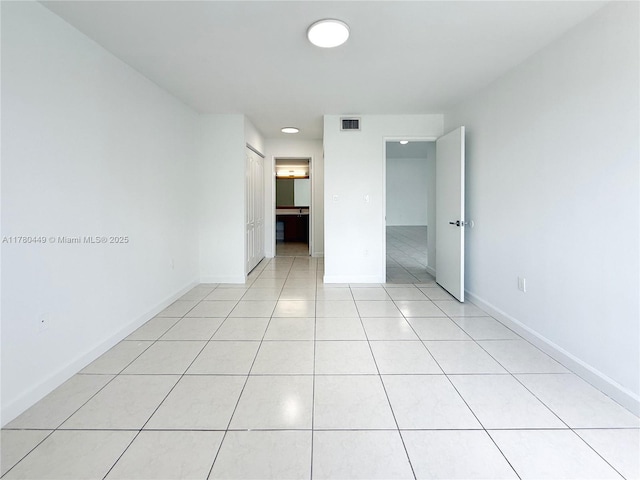 4756 NW 97th Ct Unit 79, Doral, FL 33178 - empty room featuring light tile patterned floors, baseboards, and visible vents