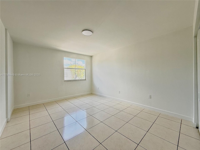 4756 NW 97th Ct Unit 79, Doral, FL 33178 - unfurnished room featuring baseboards and light tile patterned flooring