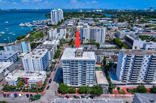 aerial view featuring a city view and a water view