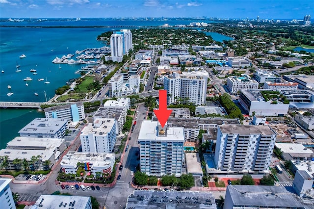 bird's eye view featuring a view of city and a water view