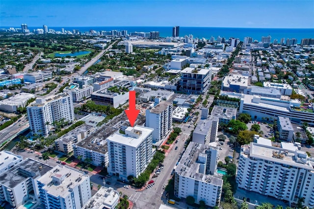 aerial view featuring a city view and a water view