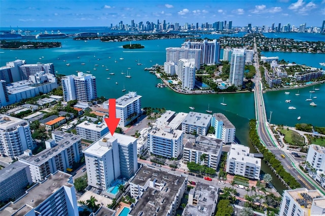 drone / aerial view with a water view and a city view