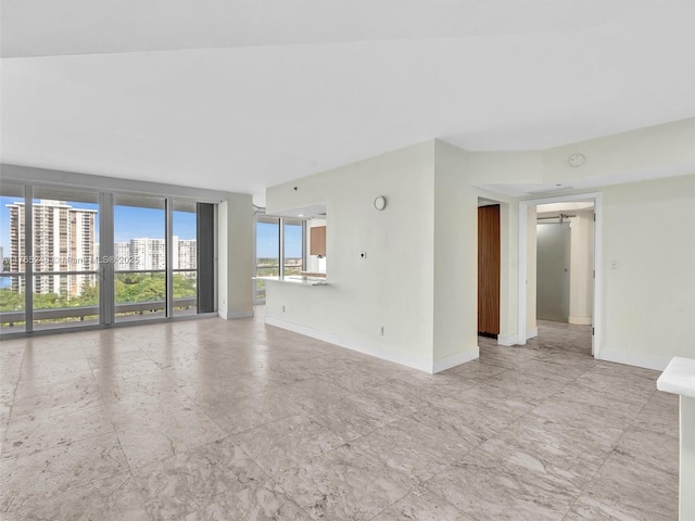 7000 Island Blvd Unit 1208, Aventura, FL 33160 - unfurnished living room with baseboards