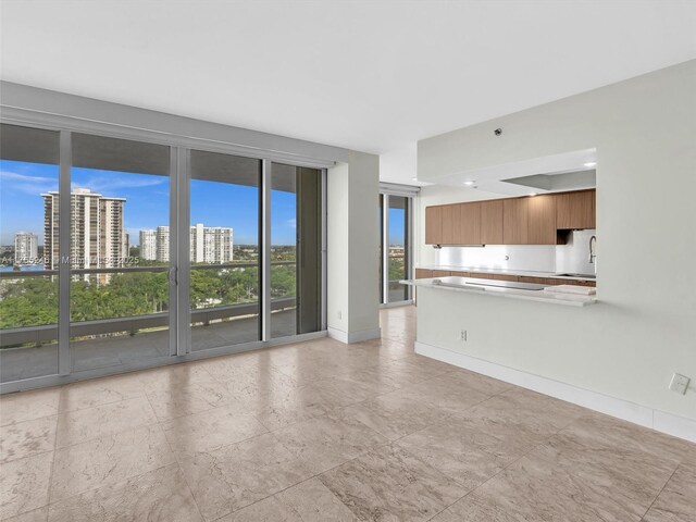 7000 Island Blvd Unit 1208, Aventura, FL 33160 - unfurnished living room with a sink and a city view