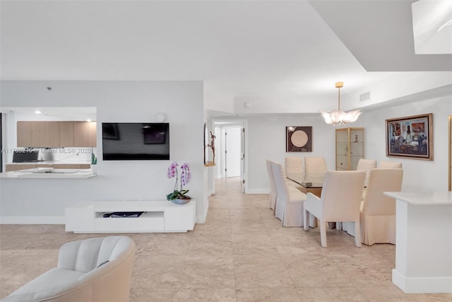 7000 Island Blvd Unit 1208, Aventura, FL 33160 - dining space featuring baseboards and a chandelier