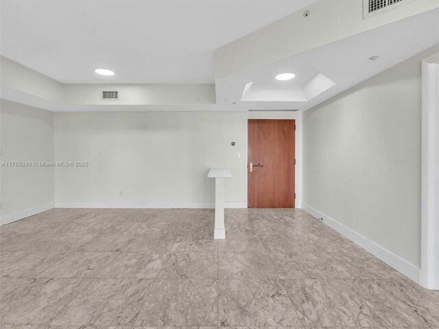7000 Island Blvd Unit 1208, Aventura, FL 33160 - empty room featuring a tray ceiling and baseboards