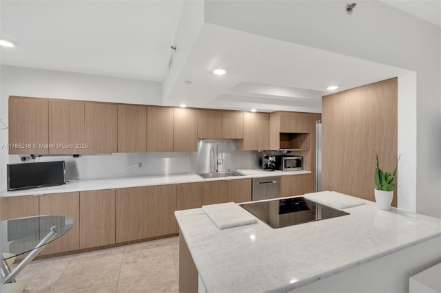7000 Island Blvd Unit 1208, Aventura, FL 33160 - kitchen with a sink, modern cabinets, stainless steel appliances, a raised ceiling, and recessed lighting
