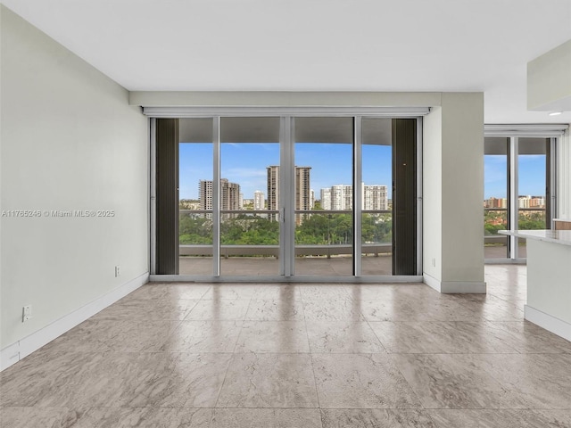 7000 Island Blvd Unit 1208, Aventura, FL 33160 - unfurnished room with a view of skyline and stone tile flooring