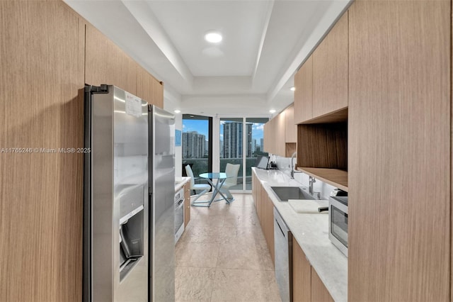 7000 Island Blvd Unit 1208, Aventura, FL 33160 - kitchen with stainless steel appliances, light brown cabinets, modern cabinets, floor to ceiling windows, and recessed lighting