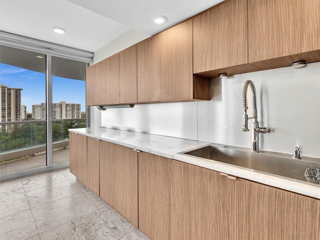 7000 Island Blvd Unit 1208, Aventura, FL 33160 - kitchen featuring light countertops, a city view, and modern cabinets