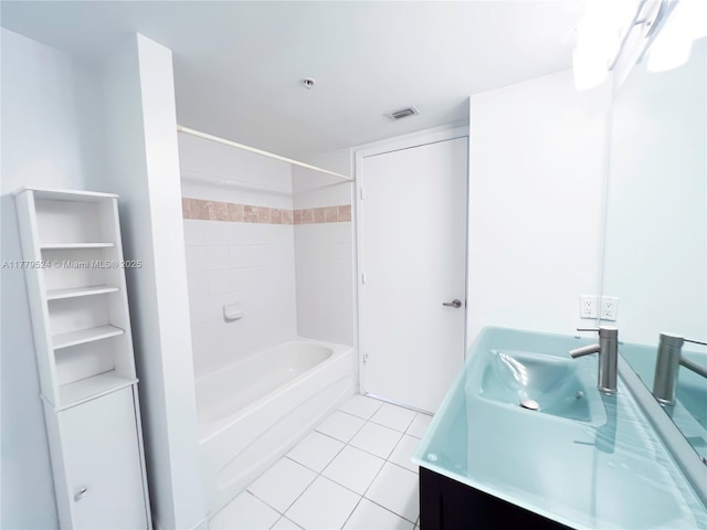 bathroom with vanity, tile patterned flooring, visible vents, and  shower combination