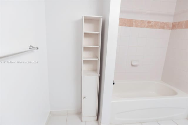 full bathroom with tile patterned floors and baseboards