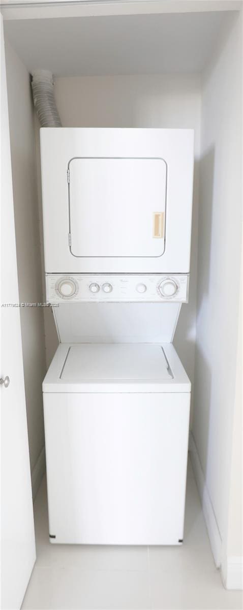 laundry area with stacked washing maching and dryer and laundry area