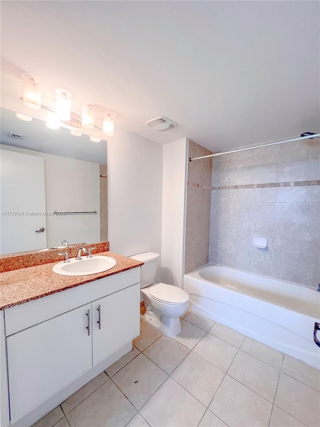 full bathroom featuring bathing tub / shower combination, tile patterned floors, vanity, and toilet
