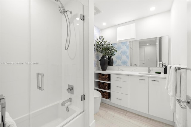 2679 NE 8th Ave, Wilton Manors, FL 33334 - kitchen with modern cabinets, wall chimney range hood, appliances with stainless steel finishes, a sink, and light tile patterned floors